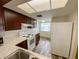 Bright kitchen with white appliances, wood-look floors and ample cabinet space at 3311 Teeside Dr, New Port Richey, FL 34655