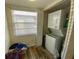 Laundry room featuring stackable washer and dryer and storage area at 3311 Teeside Dr, New Port Richey, FL 34655