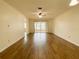 Spacious living room with tile flooring and sliding glass doors at 3311 Teeside Dr, New Port Richey, FL 34655