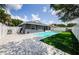 Fully fenced backyard features a beautiful pool and a paver patio with lush lawn at 382 Tavernier Cir, Oldsmar, FL 34677