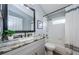Bathroom featuring a shower over tub, vanity with marble countertop, and dark hardware at 382 Tavernier Cir, Oldsmar, FL 34677