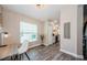 Bright dining area features wood-look flooring and a large window for natural light at 382 Tavernier Cir, Oldsmar, FL 34677
