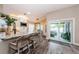 Inviting kitchen features an island with seating and access to an outdoor patio at 382 Tavernier Cir, Oldsmar, FL 34677