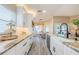 Open kitchen with a white farmhouse sink, stainless appliances, and plenty of storage at 382 Tavernier Cir, Oldsmar, FL 34677