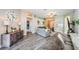Open-concept living area with wood-look floors, neutral paint, and seamless flow to other living spaces at 382 Tavernier Cir, Oldsmar, FL 34677
