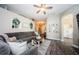 Bright and airy living room showcasing wood-look floors, comfortable furniture, and stylish decor at 382 Tavernier Cir, Oldsmar, FL 34677