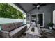A patio with a ceiling fan and comfortable outdoor furniture at 382 Tavernier Cir, Oldsmar, FL 34677