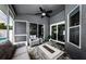 A patio with a ceiling fan and outdoor furniture at 382 Tavernier Cir, Oldsmar, FL 34677