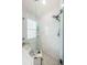 Contemporary shower boasts marble walls, glass enclosure, and dual showerheads at 382 Tavernier Cir, Oldsmar, FL 34677