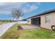 A spacious backyard features a screen patio, white fence and view at 3914 Round Table Ct, Land O Lakes, FL 34638