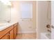 Bathroom with double sinks, tile flooring, and a shower and tub combination at 3914 Round Table Ct, Land O Lakes, FL 34638