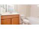 Bathroom featuring a sink, toilet, and shower and tub combination at 3914 Round Table Ct, Land O Lakes, FL 34638