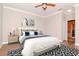 Comfortable bedroom showcasing a queen-sized bed, neutral tones, and a ceiling fan at 3914 Round Table Ct, Land O Lakes, FL 34638