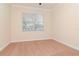 Bedroom featuring a window with blinds, neutral paint, and carpet flooring at 3914 Round Table Ct, Land O Lakes, FL 34638