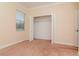 Bright bedroom with a closet, neutral paint, and carpet flooring and a window with blinds at 3914 Round Table Ct, Land O Lakes, FL 34638