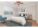 Comfortable bedroom with a plush bed, stylish decor, and a large window at 3914 Round Table Ct, Land O Lakes, FL 34638