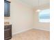 Bright dining area featuring neutral walls, tile flooring, and a window for natural light at 3914 Round Table Ct, Land O Lakes, FL 34638
