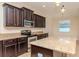 Well-equipped kitchen featuring stainless steel appliances, granite countertops and a center island at 3914 Round Table Ct, Land O Lakes, FL 34638