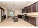 Well-equipped kitchen featuring stainless steel appliances, granite countertops and a center island at 3914 Round Table Ct, Land O Lakes, FL 34638