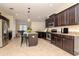 Well-equipped kitchen featuring stainless steel appliances, granite countertops and a center island at 3914 Round Table Ct, Land O Lakes, FL 34638