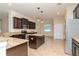Well-equipped kitchen featuring stainless steel appliances, granite countertops and a center island at 3914 Round Table Ct, Land O Lakes, FL 34638
