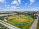 Aerial view showcases the expansive baseball fields surrounded by lush greenery and city infrastructure at 3922 Fontainebleau Dr, Tampa, FL 33634