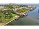 Waterfront property with verdant lawns, docks and fire pit at 3922 Fontainebleau Dr, Tampa, FL 33634