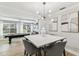 Stylish dining room with marble table, modern lighting, and a view of the adjacent recreation area at 3922 Fontainebleau Dr, Tampa, FL 33634