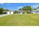 Charming single-story home featuring a well-manicured lawn and attractive landscaping enhancing its curb appeal at 3922 Fontainebleau Dr, Tampa, FL 33634