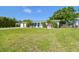 Single-story home featuring manicured landscaping, a vibrant blue front door, and a convenient attached two-car garage at 3922 Fontainebleau Dr, Tampa, FL 33634