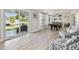 Bright game room featuring light flooring and sliding doors overlooking the backyard and canal at 3922 Fontainebleau Dr, Tampa, FL 33634