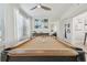 Game room featuring a pool table with a window view, perfect for entertainment and relaxation at 3922 Fontainebleau Dr, Tampa, FL 33634