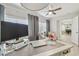 Bright, airy home office with modern desk, gray color palette and view to the pool table in the next room at 3922 Fontainebleau Dr, Tampa, FL 33634