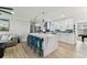 Spacious kitchen with marble island, white cabinets, stainless steel appliances, and bar seating at 3922 Fontainebleau Dr, Tampa, FL 33634