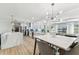 Spacious kitchen with marble island, stainless steel appliances, and an open layout with pool table view at 3922 Fontainebleau Dr, Tampa, FL 33634