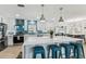 Modern kitchen featuring a large island with marble countertop, white cabinets, and stainless steel appliances at 3922 Fontainebleau Dr, Tampa, FL 33634