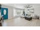 Bright living room featuring a comfortable gray sectional, stylish decor, and a large window at 3922 Fontainebleau Dr, Tampa, FL 33634