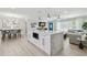Spacious open-concept living area with a central island, dining space, and cozy seating at 3922 Fontainebleau Dr, Tampa, FL 33634