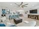 Bright living room with an open floor plan, stylish furniture, and a view of the modern kitchen at 3922 Fontainebleau Dr, Tampa, FL 33634
