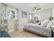 Cozy bedroom featuring light flooring, sheer curtains, and a picturesque window view at 3922 Fontainebleau Dr, Tampa, FL 33634