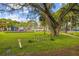 A charming neighborhood park featuring a playground, picnic tables, and a bike rack set against a lush green backdrop at 3922 Fontainebleau Dr, Tampa, FL 33634