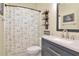 Bathroom featuring anchor themed shower curtain, matching vanity and decor at 4063 Ligustrum Dr, Palm Harbor, FL 34685