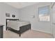 Minimalist bedroom featuring a bed, closet, and window at 4063 Ligustrum Dr, Palm Harbor, FL 34685