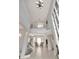 Bright foyer featuring soaring ceilings, stylish chandelier, and an open floor plan to the light-filled living spaces at 4063 Ligustrum Dr, Palm Harbor, FL 34685