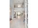 View of the tiled foyer leading to a living area with natural lighting at 4063 Ligustrum Dr, Palm Harbor, FL 34685