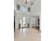 View of the tiled foyer with grand ceilings and natural lighting at 4063 Ligustrum Dr, Palm Harbor, FL 34685