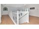 Upstairs hallway with natural light and an open, airy feel at 4063 Ligustrum Dr, Palm Harbor, FL 34685