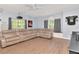 Entertainment space with a sectional, projector, and large windows at 4063 Ligustrum Dr, Palm Harbor, FL 34685