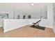 Upstairs loft space with wood flooring and a ceiling fan at 4063 Ligustrum Dr, Palm Harbor, FL 34685