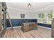 Home office boasts custom wainscoting, and a large desk at 4063 Ligustrum Dr, Palm Harbor, FL 34685